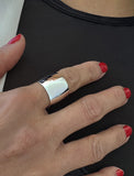 Image Title Female model wearing wide RICH thick bold chunky statement cigar band ring in 925 sterling silver by Sonia Hou, a celebrity AAPI Chinese demi-fine jewelry designer