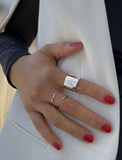 Image Title Female model wearing wide RICH thick bold chunky statement cigar band ring in 925 sterling silver by Sonia Hou, a celebrity AAPI Chinese demi-fine jewelry designer