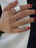 Female model wearing wide RICH thick bold chunky statement cigar band ring in 925 sterling silver by Sonia Hou, a celebrity AAPI Chinese demi-fine jewelry designer