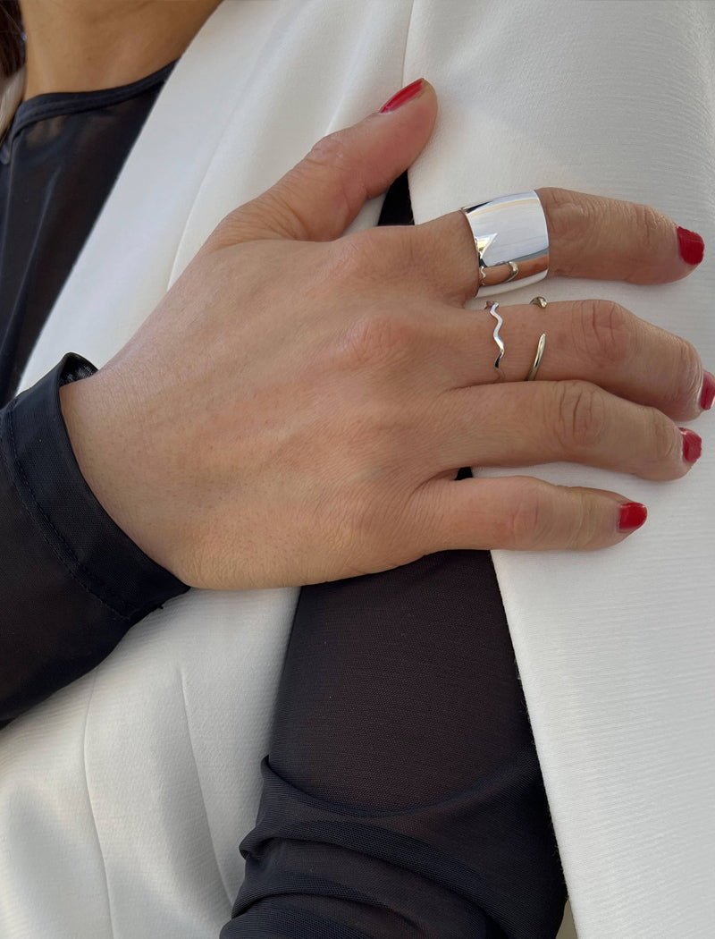 Image Title Female model wearing Asian Inspired Thin Wavy Ramen Noodle Stacking Ring in 925 Sterling Silver base by Sonia Hou, a celebrity AAPI Chinese demi-fine jewelry designer