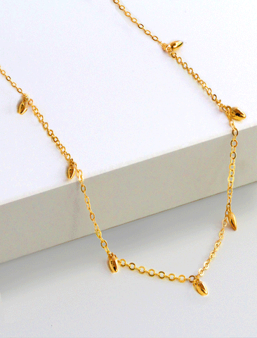 Image Title Female model wearing inclusive Asian Inspired Thin Rice Bead Minimalist Chain Layering Stacking Necklace in 18K Gold Vermeil With Sterling Silver base by Sonia Hou, a celebrity AAPI Chinese demi-fine jewelry designer