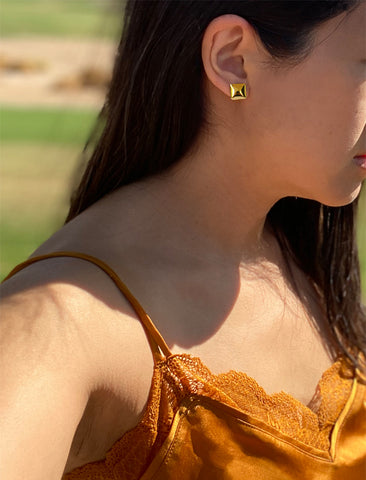 Image Title Female model wearing inclusive, minimalist SQAURE stud small chunky bold thick statement earrings in 18K Gold Vermeil with 925 Sterling Silver base by Sonia Hou, a celebrity AAPI Chinese demi-fine jewelry designer