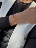 Female model wearing adjustable minimalist simple Success Thin Cuff Chunky Bold Layering Stacking Statement 2 Way convertible Bangle Cuff Open Bracelet in 18K Rose Gold Vermeil with 925 sterling silver base by Sonia Hou, a celebrity AAPI Chinese demi-fine fashion costume jewelry designer