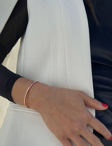 Image Title Female model wearing adjustable minimalist simple Success Thin Cuff Chunky Bold Layering Stacking Statement 2 Way convertible Bangle Cuff Open Bracelet in 18K Rose Gold Vermeil with 925 sterling silver base by Sonia Hou, a celebrity AAPI Chinese demi-fine fashion costume jewelry designer