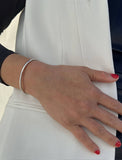 Image Title Female model wearing adjustable minimalist simple Success Thin Cuff Chunky Bold Layering Stacking Statement 2 Way convertible Bangle Cuff Open Bracelet in 925 sterling silver by Sonia Hou, a celebrity AAPI Chinese demi-fine fashion costume jewelry designer