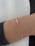 Image Title Female model wearing adjustable minimalist simple Success Thin Cuff Chunky Bold Layering Stacking Statement 2 Way convertible Bangle Cuff Open Bracelet in 18K Rose Gold Vermeil with 925 sterling silver base by Sonia Hou, a celebrity AAPI Chinese demi-fine fashion costume jewelry designer