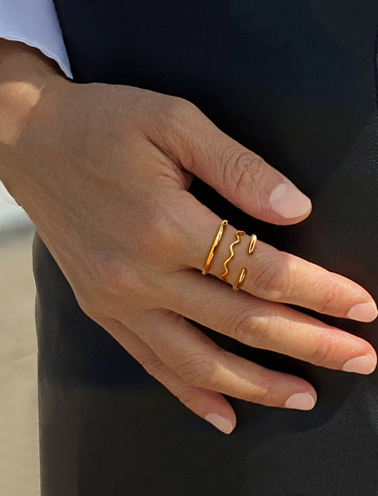 Female model wearing adjustable minimalist Success Simple Midi Thick Chunky Thin Bold Layering Stacking Statement 2 Way Convertible Band Open Ring in 18K Rose Gold Vermeil with 925 sterling silver base by Sonia Hou, a celebrity AAPI Chinese demi-fine fashion costume jewelry designer