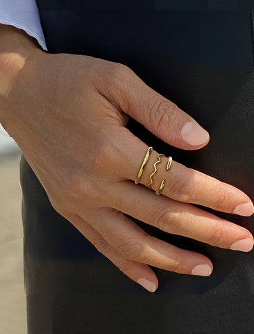 Image Title Female model wearing Asian Inspired Thin Wavy Ramen Noodle Stacking Ring in 925 Sterling Silver base by Sonia Hou, a celebrity AAPI Chinese demi-fine jewelry designer