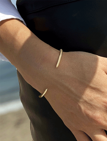 Image Title Female model wearing adjustable minimalist simple Success Thin Cuff Chunky Bold Layering Stacking Statement 2 Way convertible Bangle Cuff Open Bracelet in 925 sterling silver by Sonia Hou, a celebrity AAPI Chinese demi-fine fashion costume jewelry designer