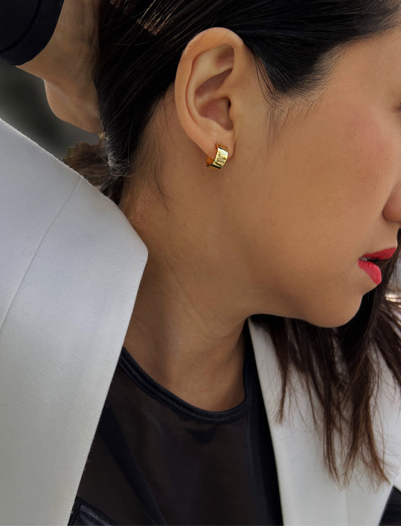 Female model wearing BOSS 18K GOLD VERMEIL OVER STERLING SILVER MINIMALIST CHUBBY MINI SMALL HOOP EARRINGS by Sonia Hou Jewelry