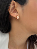 Female model wearing BOSS 18K ROSE GOLD VERMEIL OVER STERLING SILVER MINIMALIST CHUBBY MINI SMALL ROUND HOOP EARRINGS by Sonia Hou Jewelry
