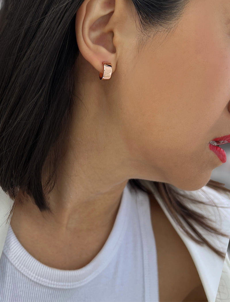 Female model wearing BOSS 18K ROSE GOLD VERMEIL OVER STERLING SILVER MINIMALIST CHUBBY MINI SMALL HOOP EARRINGS by Sonia Hou Jewelry
