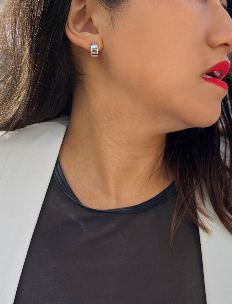 Female model wearing minimalist dainty small thick bold everyday BOSS 925 Sterling Silver Chubby Mini Huggie Hoop Earrings by Sonia Hou, a celebrity Chinese AAPI demi-fine fashion costume jewelry designer