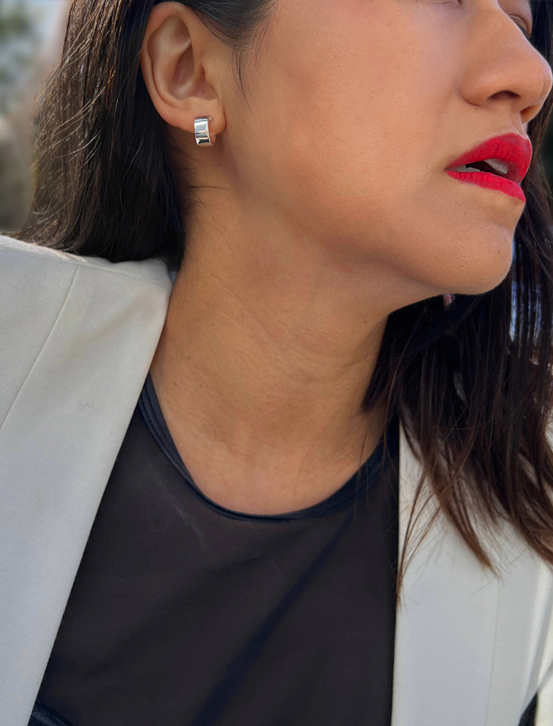 Female model wearing minimalist dainty small thick bold everyday BOSS 925 Sterling Silver Chubby Mini Huggie Hoop Earrings by Sonia Hou, a celebrity Chinese AAPI demi-fine fashion costume jewelry designer