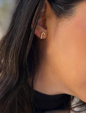 Female model wearing Candy Cane Holiday Festive Christmas Earrings in 18K Gold Over With Sterling Silver by AAPI Celebrity Jewelry Designer Sonia Hou 