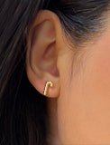 Female model wearing Candy Cane Holiday Festive Christmas Earrings in 18K gold over Sterling Silver by AAPI Celebrity Jewelry Designer Sonia Hou 