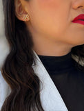 Female model wearing Holiday Coquette Bow Festive Christmas Stud Earrings in 18K Gold Over With Sterling Silver by AAPI Celebrity Jewelry Designer Sonia Hou 