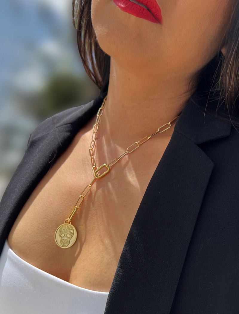 Female model wearing gender neutral, culturally inclusive Day Of The Dead Mexican Sugar Skull Charm 3-Way Convertible Coin Pendant with a Large Paperclip Link Chain Statement Bold Thick Chunky Layering Stacking Rectangular Necklace in 18K Gold Vermeil Over Sterling Silver by Sonia Hou, a celebrity AAPI Chinese demi-fine jewelry designer. This holiday is also known as Dia De Los Muertos, and can also be worn for Halloween!