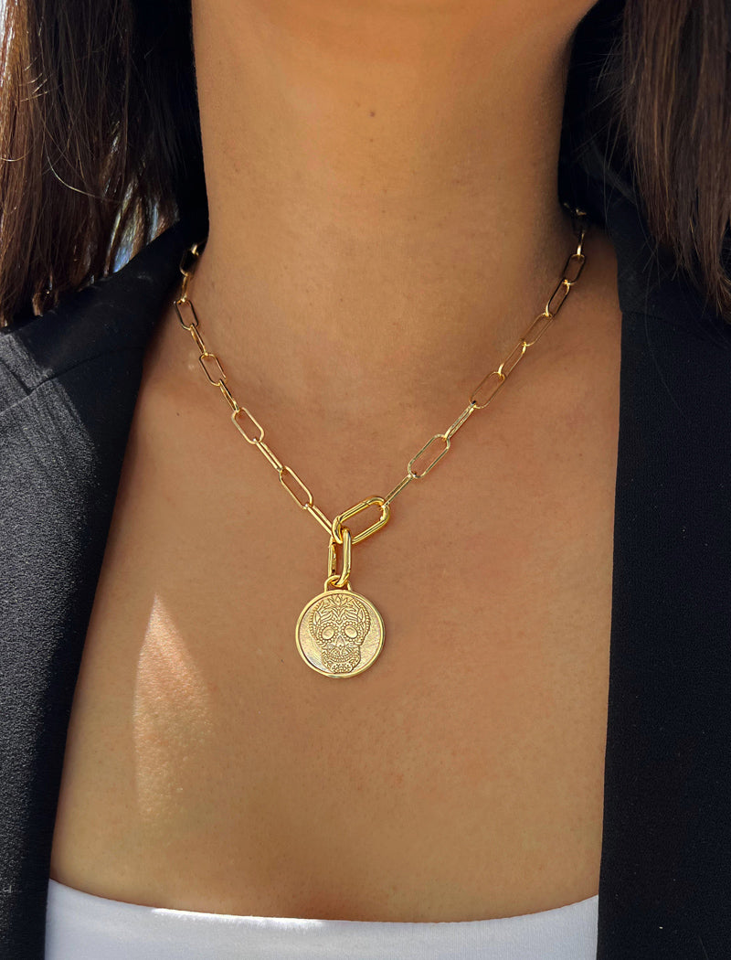 Female model wearing gender neutral, culturally inclusive Day Of The Dead Mexican Sugar Skull Charm 3-Way Convertible Coin Pendant with a Large Paperclip Link Chain Statement Bold Thick Chunky Layering Stacking Rectangular Necklace in 18K Gold Vermeil Over Sterling Silver by Sonia Hou, a celebrity AAPI Chinese demi-fine jewelry designer. This holiday is also known as Dia De Los Muertos, and can also be worn for Halloween!