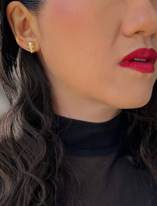 Woman wearing Culturally inclusive Day Of The Dead Mexican Sugar Skull Stud Earrings in 18K Gold over Sterling Silver by Sonia Hou, a celebrity AAPI Chinese demi-fine jewelry designer. This holiday is also known as Dia De Los Muertos, and can also be worn for Halloween!