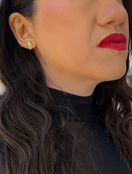 Woman wearing Culturally inclusive Day Of The Dead Mexican Sugar Skull Stud Earrings in 18K Gold over Sterling Silver by Sonia Hou, a celebrity AAPI Chinese demi-fine jewelry designer. This holiday is also known as Dia De Los Muertos, and can also be worn for Halloween!