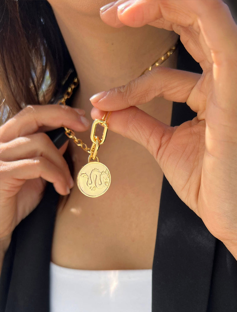 Female model wearing gender neutral Asian Inspired Lucky Chinese Zodiac Dragon Charm 3-Way Convertible Coin Pendant with a Large Paperclip Link Chain Statement Bold Thick Chunky Layering Stacking Rectangular Necklace in 18K Gold Vermeil Over Sterling Silver by Sonia Hou, a celebrity AAPI Chinese demi-fine jewelry designer. Promotes good luck, wisdom, wealth, power and good fortune