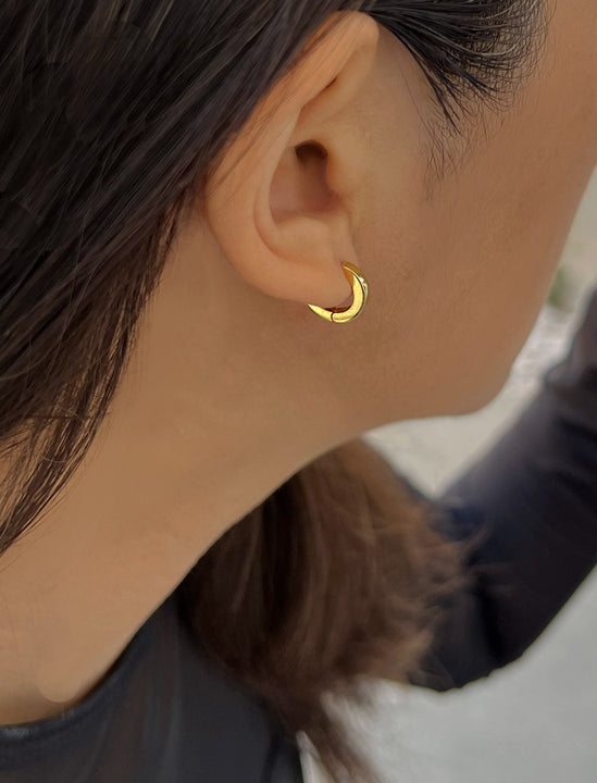 Woman wearing Essential Minimalist 18K Gold Vermeil With 925 Sterling Silver base mini small tiny chunky bold thick dainty stacking layering statement round hoop huggie earrings by Sonia Hou, a celebrity AAPI Chinese demi-fine jewelry designer