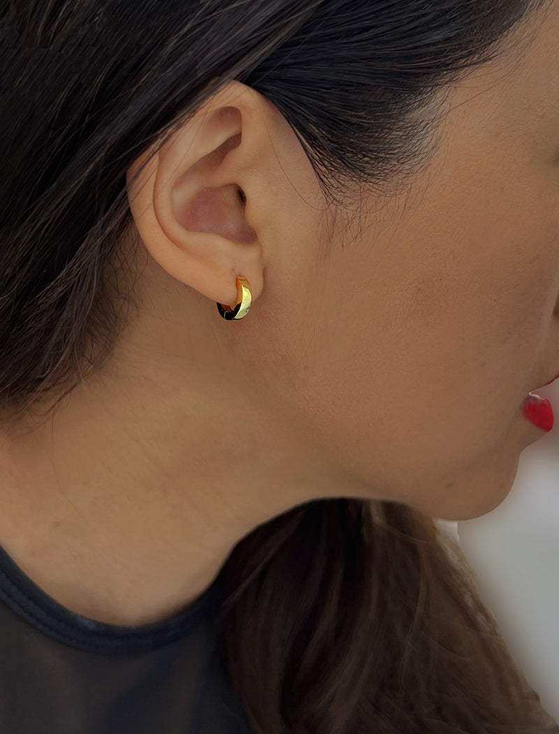 Woman wearing Essential Minimalist 18K Gold Vermeil With 925 Sterling Silver base mini small tiny chunky bold thick dainty stacking layering statement round hoop huggie earrings by Sonia Hou, a celebrity AAPI Chinese demi-fine jewelry designer