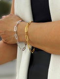 18K gold vermeil (sterling silver base) chain bracelet on a person's wrist.  Our medium Essential paperclip link chain bracelet is perfect for everyday wear. Designed by AAPI celebrity jewelry designer SONIA HOU.