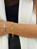 18K gold vermeil (sterling silver base) chain bracelet on a person's wrist.  Our medium Essential paperclip link chain bracelet is perfect for everyday wear. Designed by AAPI celebrity jewelry designer SONIA HOU.