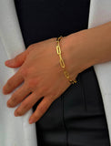18K gold vermeil (sterling silver base) chain bracelet on a person's wrist.  Our medium Essential paperclip link chain bracelet is perfect for everyday wear. Designed by AAPI celebrity jewelry designer SONIA HOU.