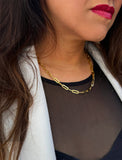 18K gold vermeil (sterling silver base) chain necklace on a person's neck.  Our medium Essential paperclip link chain necklace is perfect for everyday wear. Designed by AAPI celebrity jewelry designer SONIA HOU
