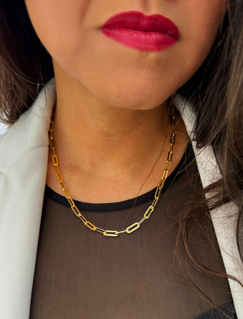 18K gold vermeil (sterling silver base) chain necklace on a person's neck.  Our medium Essential paperclip link chain necklace is perfect for everyday wear. Designed by AAPI celebrity jewelry designer SONIA HOU