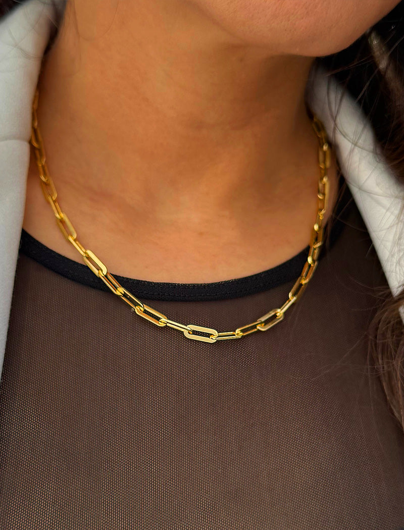 18K Gold vermeil (Sterling silver base) chain layering necklace on a person's neck.  Our medium Essential paperclip link chain necklace is perfect for everyday wear. Designed by AAPI celebrity jewelry designer SONIA HOU.