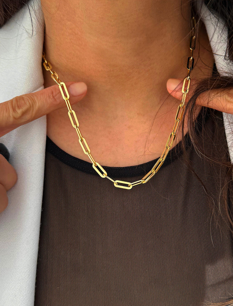 18K Gold vermeil (Sterling silver base) chain layering necklace on a person's neck.  Our medium Essential paperclip link chain necklace is perfect for everyday wear. Designed by AAPI celebrity jewelry designer SONIA HOU.
