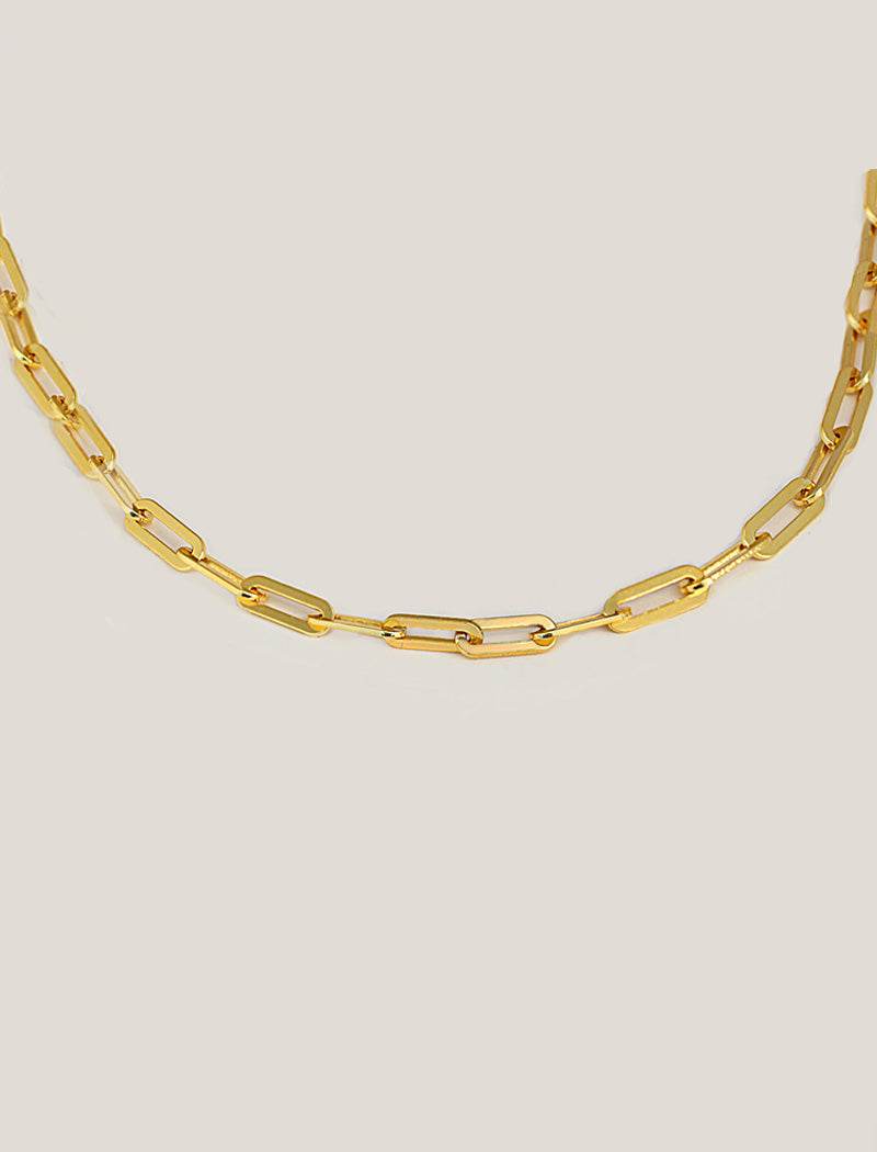 18K Gold vermeil (Sterling silver base) chain layering necklace on a person's neck.  Our medium Essential paperclip link chain necklace is perfect for everyday wear. Designed by AAPI celebrity jewelry designer SONIA HOU.