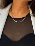 Sterling silver chain necklace on a person's neck.  Our medium Essential paperclip link chain necklace is perfect for everyday wear. Designed by AAPI celebrity jewelry designer SONIA HOU.