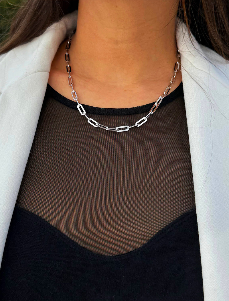 Sterling silver chain necklace on a person's neck.  Our medium Essential paperclip link chain necklace is perfect for everyday wear. Designed by AAPI celebrity jewelry designer SONIA HOU.