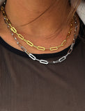 Sterling silver chain necklace on a person's neck.  Our medium Essential paperclip link chain necklace is perfect for everyday wear. Designed by AAPI celebrity jewelry designer SONIA HOU.