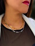 Sterling silver chain necklace on a person's neck.  Our medium Essential paperclip link chain necklace is perfect for everyday wear. Designed by AAPI celebrity jewelry designer SONIA HOU.