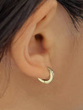 Woman wearing Essential Minimalist 925 Sterling Silver mini small tiny chunky bold thick dainty stacking layering statement round hoop huggie earrings by Sonia Hou, a celebrity Asian AAPI Chinese demi-fine jewelry designer