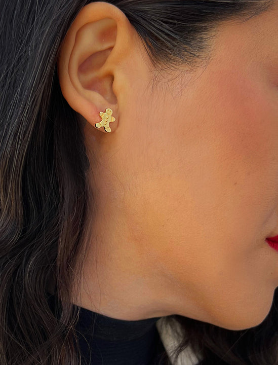 Female model wearing Gingerbread Holiday Festive Christmas Earrings in 18K Gold Over With Sterling Silver by AAPI Celebrity Jewelry Designer Sonia Hou 