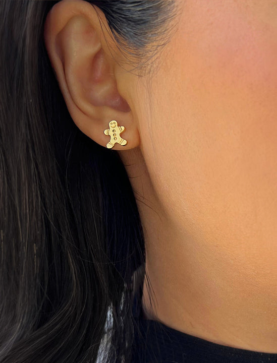 Female model wearing Gingerbread Holiday Festive Christmas Earrings in 18K gold over Sterling Silver by AAPI Celebrity Jewelry Designer Sonia Hou 