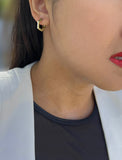 Female model wearing Minimalist mini tiny small chunky bold thick dainty stacking layering statement round INNOVATE Hexagon Huggie Hoop Earrings in 925 Sterling Silver by Sonia Hou, a celebrity Asian AAPI Chinese demi-fine jewelry designer