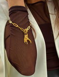 18K Gold PVD Stainless steel waterproof chain necklace with a pendant worn by a person in a brown shirt. Rooted in ancient Italian tradition, the Italian Hand — also known as Mano Cornuta or the “Horned Hand” — has long been worn as a protective amulet to ward off the Evil Eye and negative energy. Symbolizes strength, defense, and good fortune. Designed by AAPI celebrity jewelry designer SONIA HOU.
