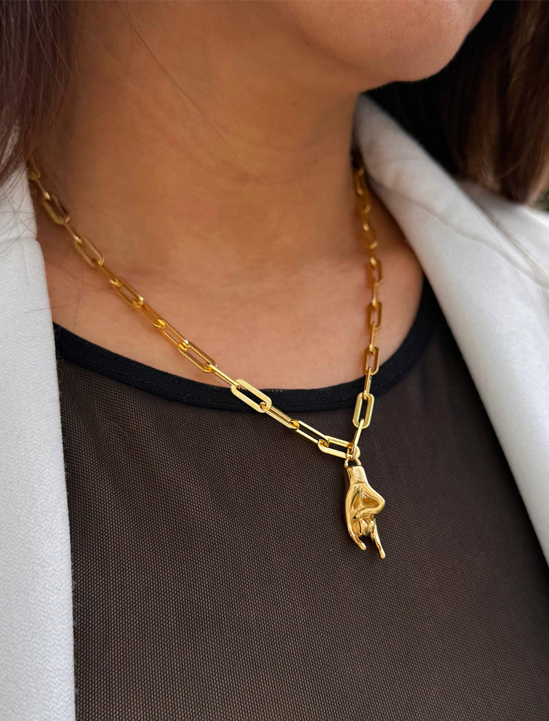 Italian Hand pendant—also known as Mano Cornuta or the “Horned Hand” amulet in 18K Gold Vermeil (sterling Silver base).  Designed for everyone who values inclusivity, diversity, and meaning, it’s a timeless statement of strength and modern style. It's perfect for everyday wear. Designed by AAPI celebrity jewelry designer SONIA HOU.