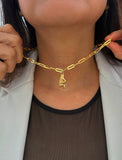 Person wearing a waterproof Italian Hand pendant necklace—also known as Mano Cornuta or the “Horned Hand” amulet in 18K Gold PVD stainless steel.  Designed for everyone who values inclusivity, diversity, and meaning, it’s a timeless statement of strength and modern style. It's perfect for everyday wear. Designed by AAPI celebrity jewelry designer SONIA HOU.