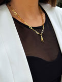 Person wearing an Italian Hand pendant—also known as Mano Cornuta or the “Horned Hand” amulet in 18K Gold Vermeil (sterling Silver base).  Designed for everyone who values inclusivity, diversity, and meaning, it’s a timeless statement of strength and modern style. It's perfect for everyday wear. Designed by AAPI celebrity jewelry designer SONIA HOU.