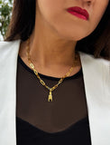 Person wearing an Italian Hand pendant—also known as Mano Cornuta or the “Horned Hand” amulet in 18K Gold Vermeil (sterling Silver base).  Designed for everyone who values inclusivity, diversity, and meaning, it’s a timeless statement of strength and modern style. It's perfect for everyday wear. Designed by AAPI celebrity jewelry designer SONIA HOU.