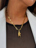 Person wearing an Italian Hand pendant—also known as Mano Cornuta or the “Horned Hand” amulet in 18K Gold Vermeil (sterling Silver base).  Designed for everyone who values inclusivity, diversity, and meaning, it’s a timeless statement of strength and modern style. It's perfect for everyday wear. Designed by AAPI celebrity jewelry designer SONIA HOU.